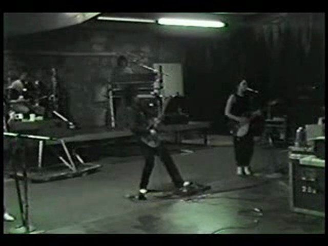 Still from video footage of rehearsals at the St. Louis Park warehouse. Robert (Bobby Z.) Rivkin on drums, Matt Fink on keyboards, Prince on guitar, Wendy Melvoin on guitar. Still from video footage of rehearsals at the St. Louis Park warehouse. Robert (Bobby Z.) Rivkin on drums, Matt Fink on keyboards, Prince on guitar, Wendy Melvoin on guitar.